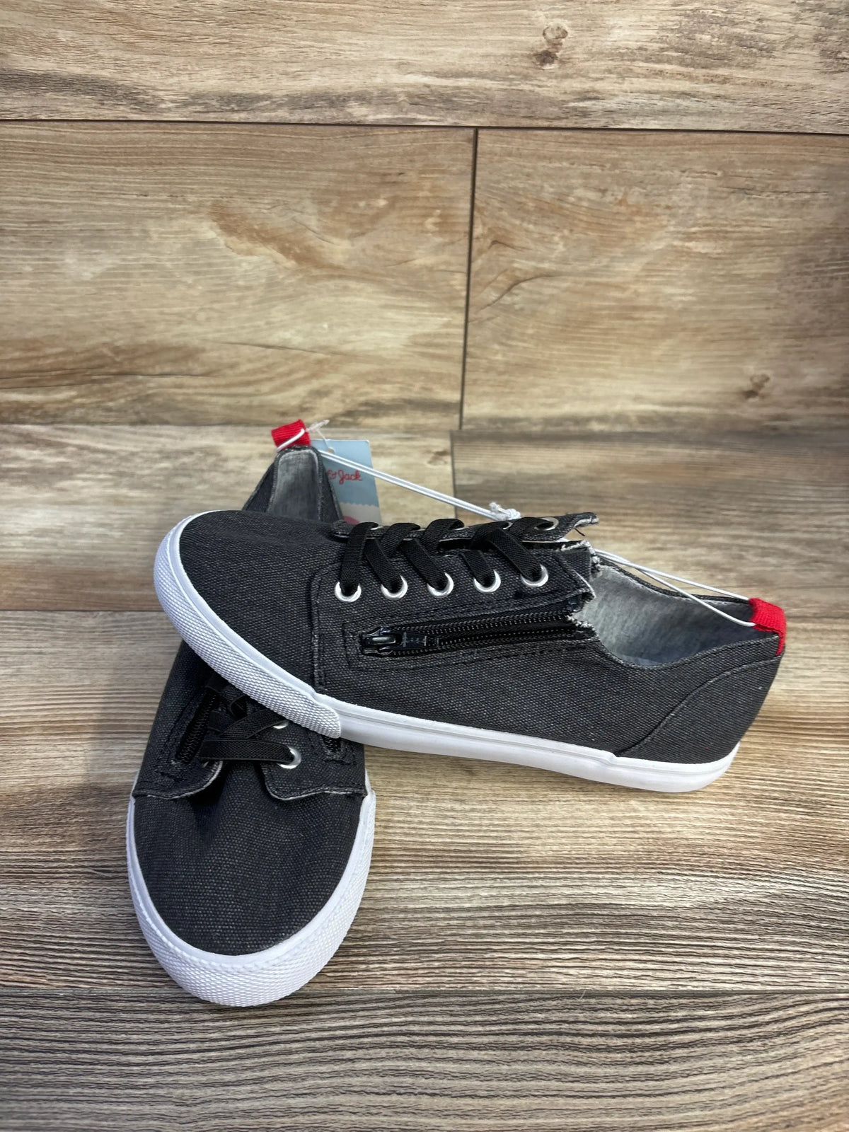 Angled view of Cat & Jack Lucian toddler sneakers with double side zipper, grey canvas and white sole on wood background, size 4Y