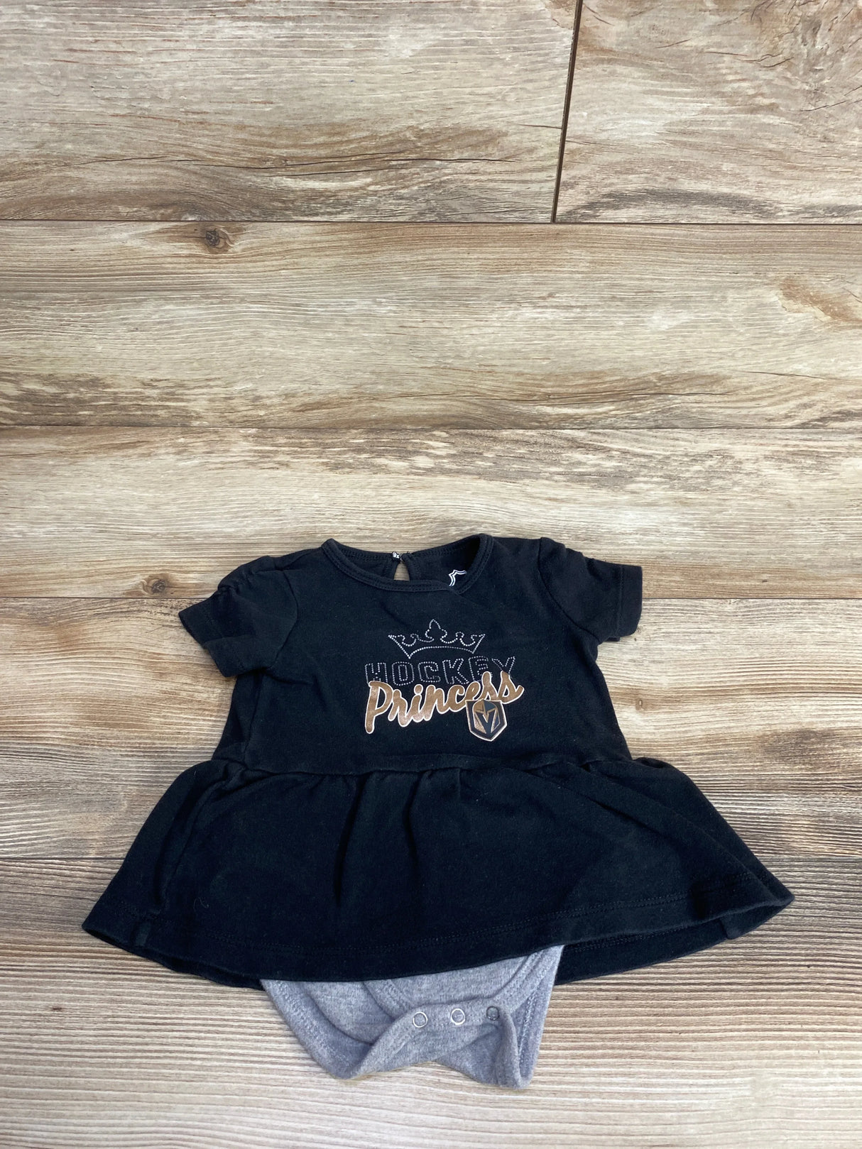 Black baby dress with Hockey Princess text and crown graphic, gray attached bodysuit