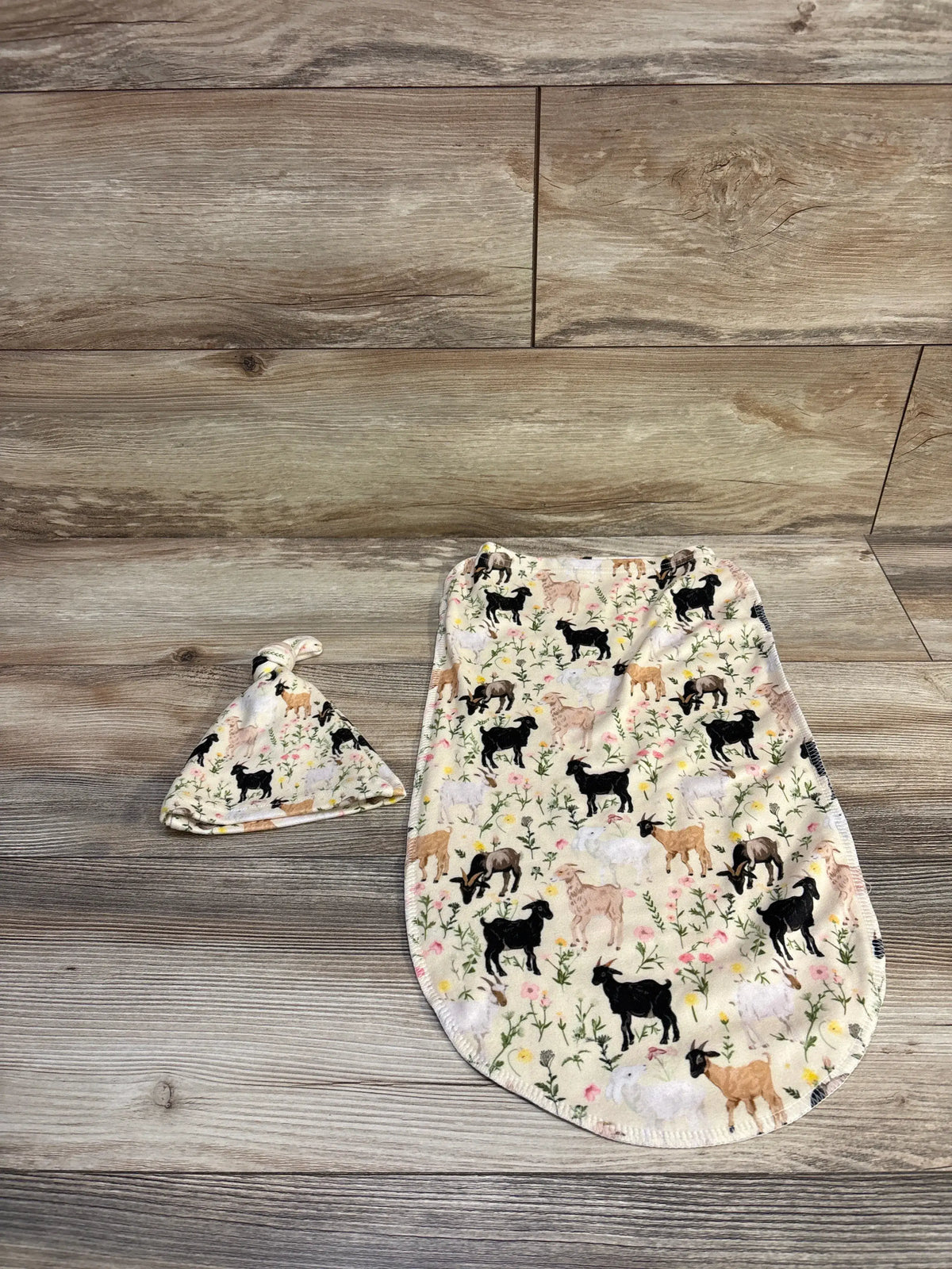 Pigsaly animal print baby swaddle sack and matching hat set in yellow