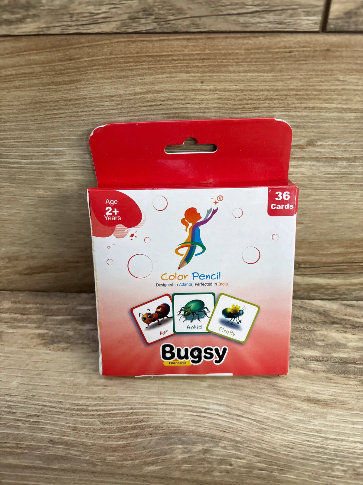 Bugsy flashcards for kids, ages 2+, featuring ant, aphid, and firefly on wood background