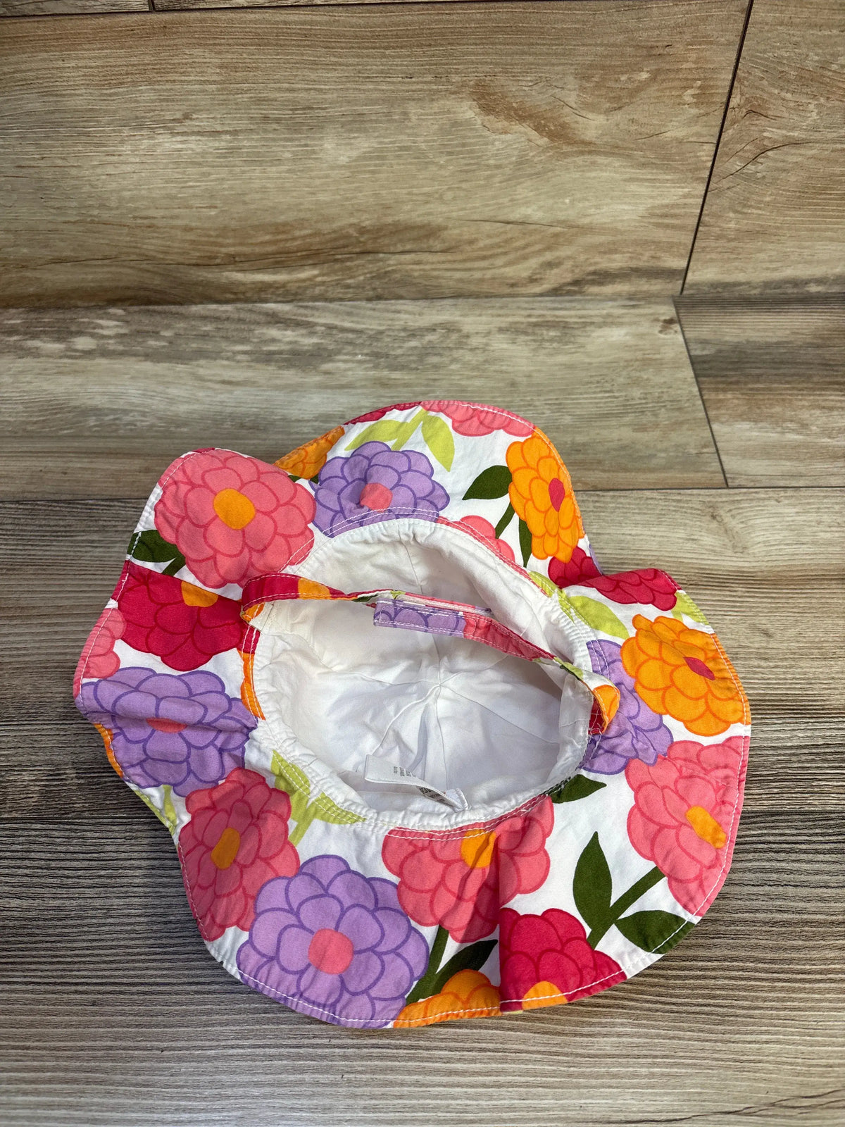 Gymboree white baby bucket hat with colorful pink, purple, and orange floral print