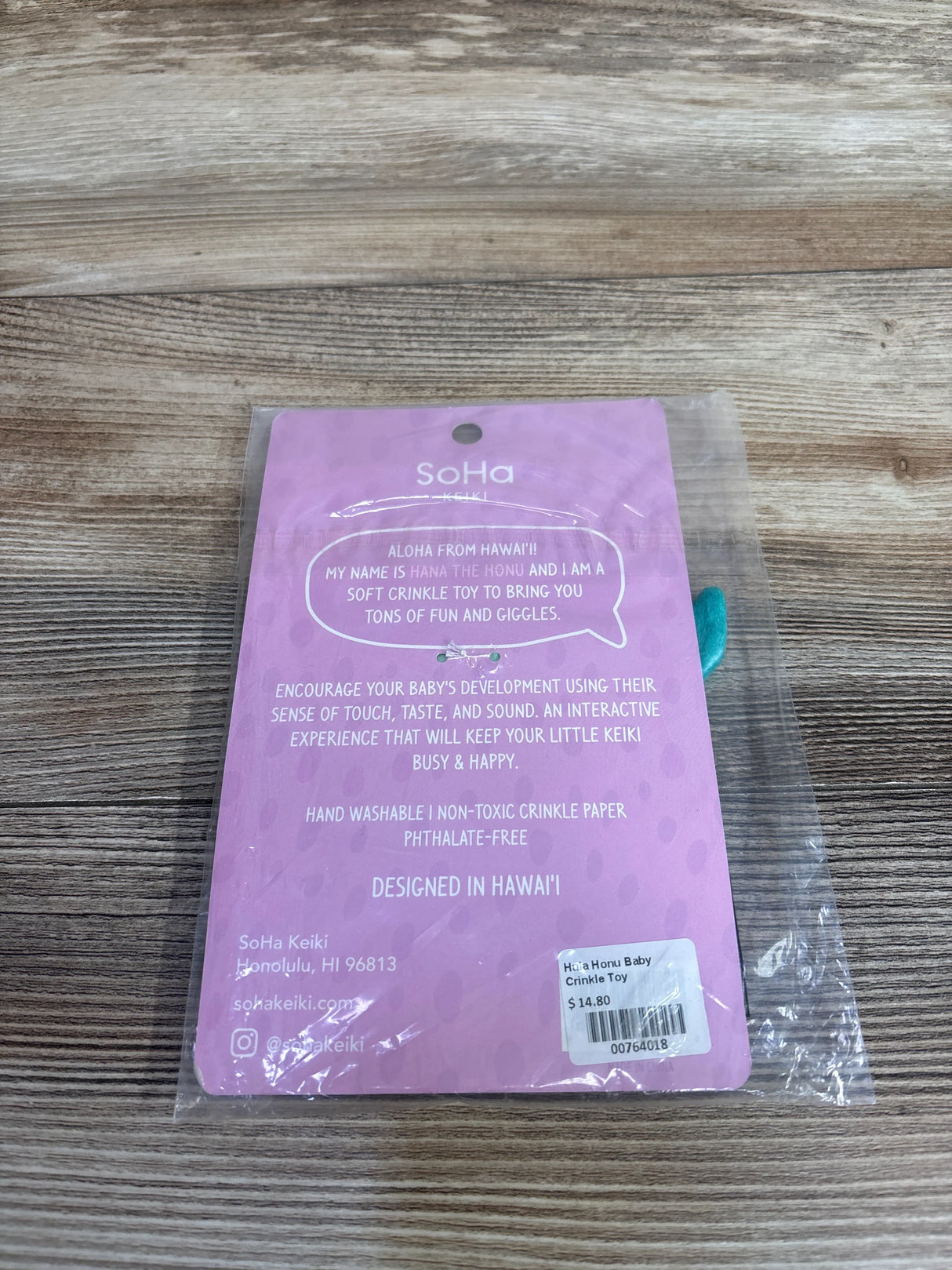 SoHa Keiki Hana Honu baby crinkle toy packaging with product description on purple backing card