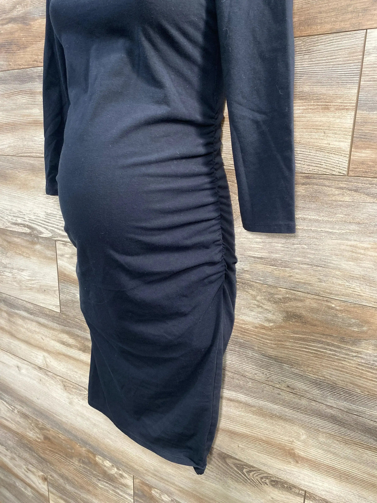 Front view of Isabel maternity solid black bodycon dress showcasing fitted silhouette with plain white background