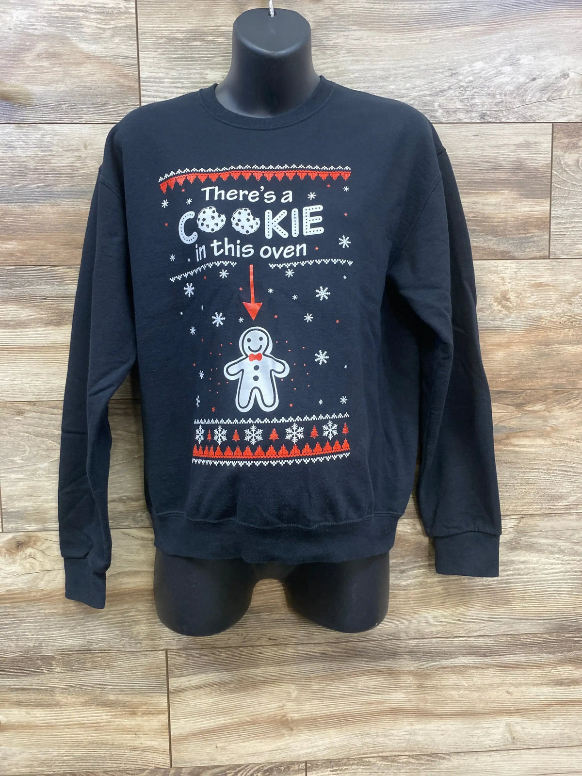 Black holiday sweatshirt with 'There's a Cookie in this oven' text and gingerbread man design