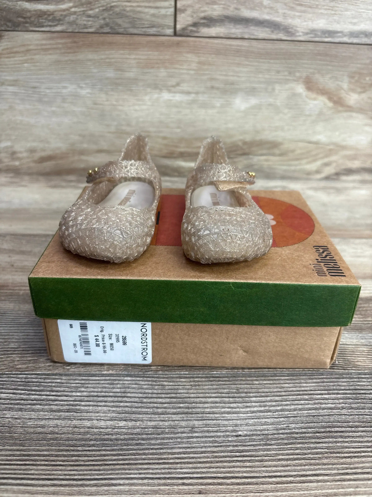 Sparkly toddler girl Mary Jane shoes with strap on box, light gold glitter finish