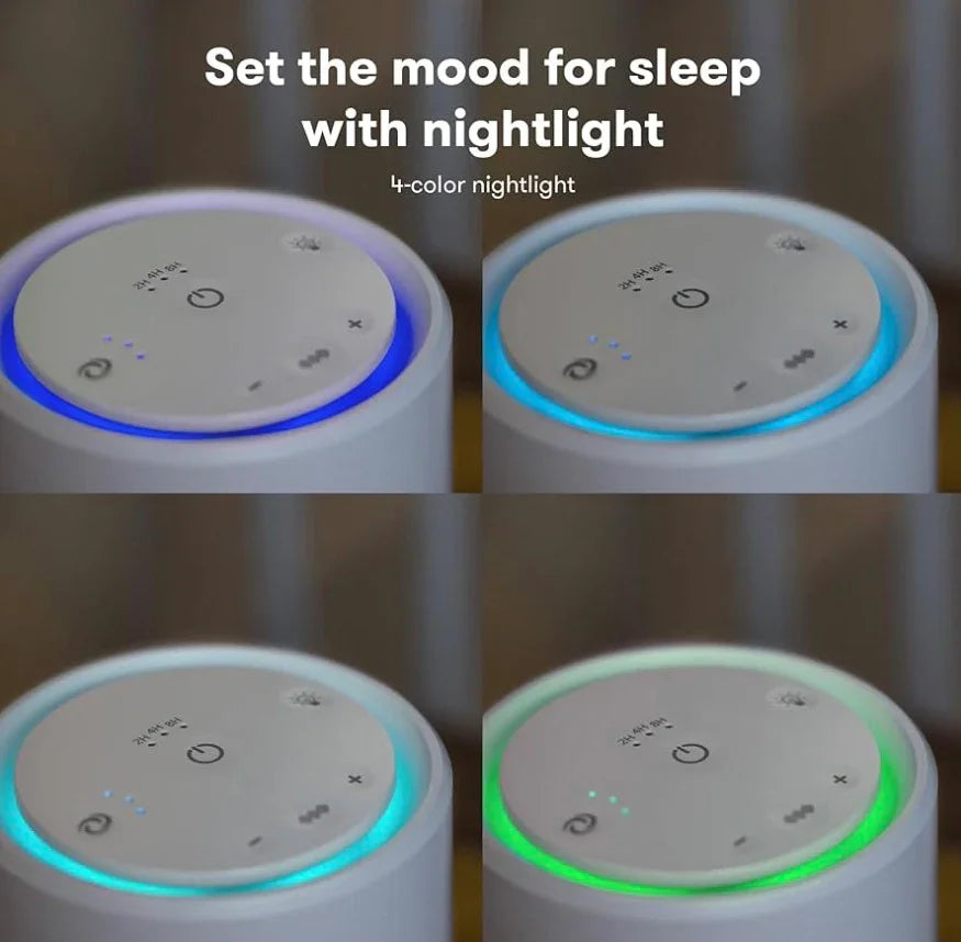 Top view of Frida Baby 3-in-1 Air Purifier Sound Machine & Nightlight showing its four-color illuminated ring and touch controls on a wooden surface