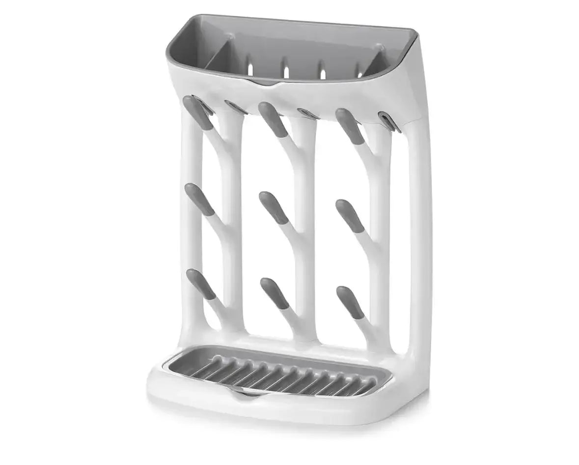 Front view of OXO Tot Space Saving Drying Rack with vertical pegs, gray tips, and removable drip tray on white background