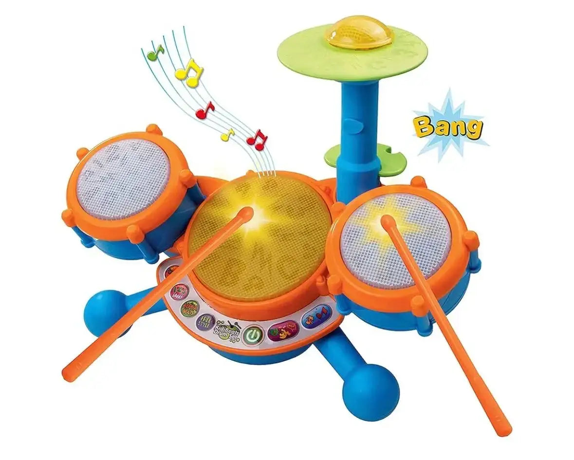 Front view of VTech KidiBeats drum set with three drums, cymbal, two orange drumsticks, light-up center pad, and control buttons on white background