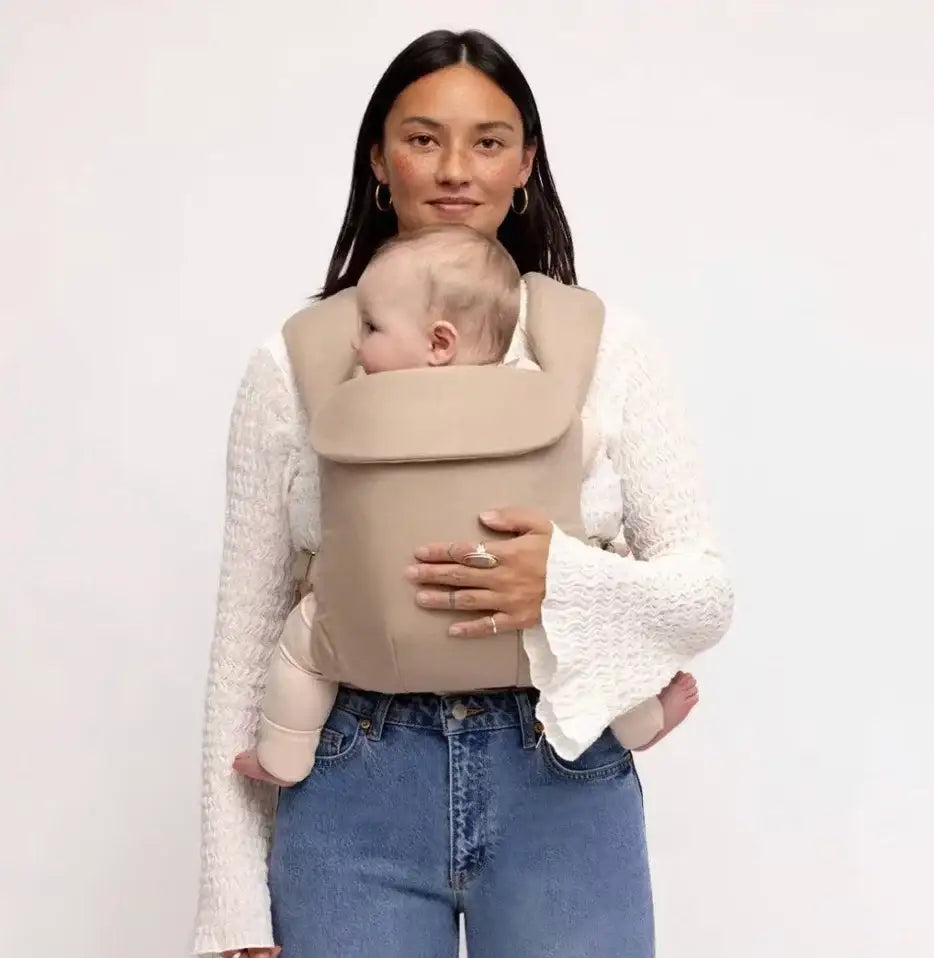 Front view of NEW Wildbird Aerial Carrier in Desert Lark showcasing padded straps with baby worn inward facing