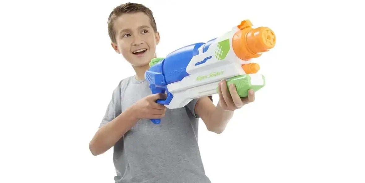 Front view of Nerf Super Soaker Barrage water gun held by boy showing colorful nozzles and pump on white background