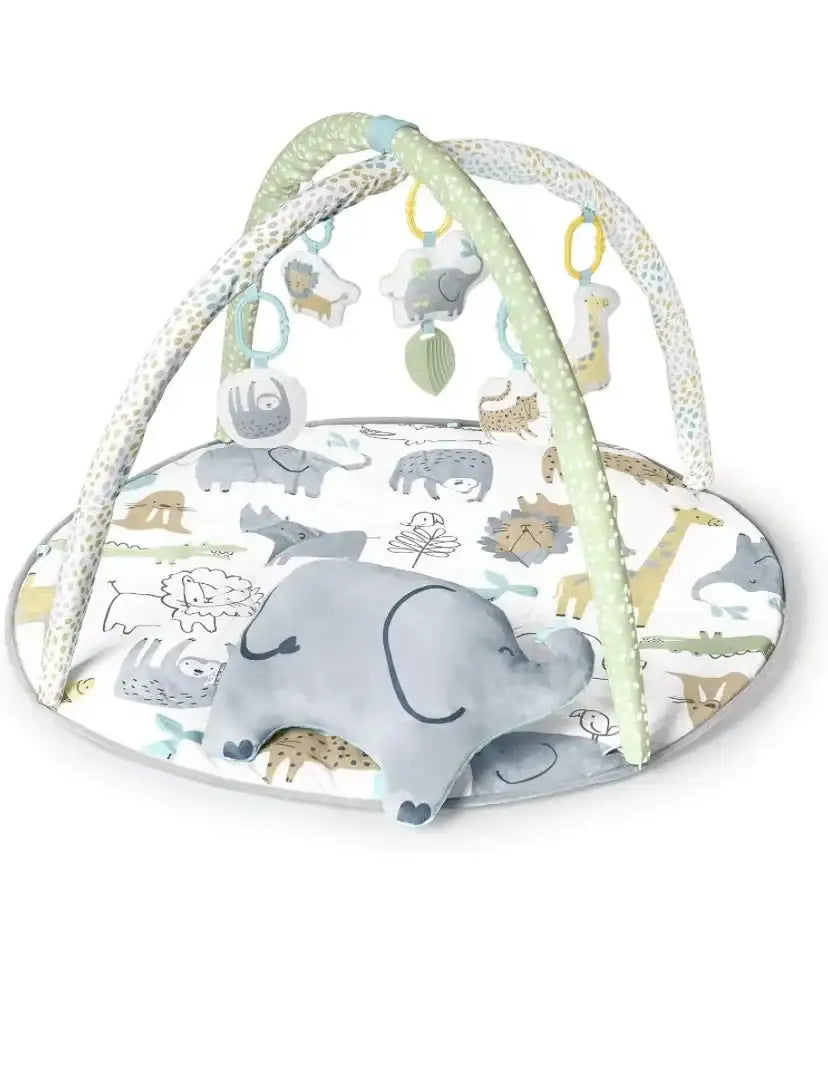 Angled view of Carter’s Safari play gym with round animal-print mat, crossed arches and hanging toys on white