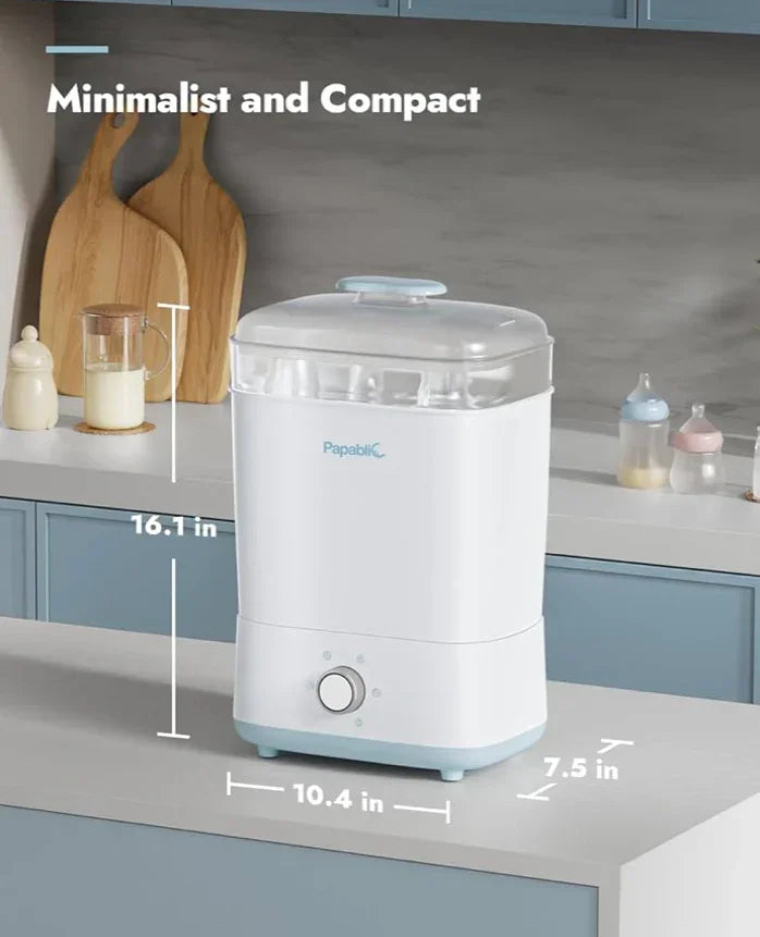Front view of Papablic baby bottle sterilizer showing clear lid and compact size (16.1 x 10.4 x 7.5 in) on kitchen counter