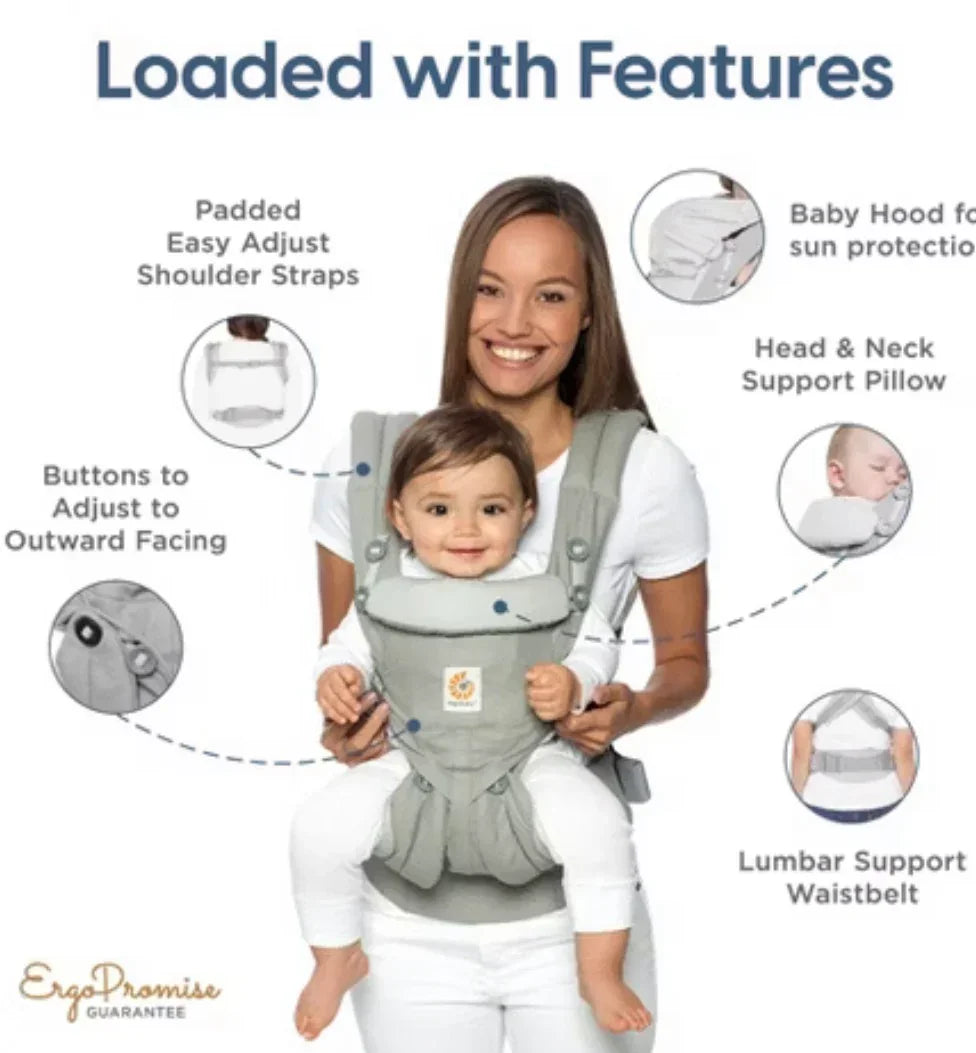 Mom carrying baby in ergonomic gray baby carrier with adjustable straps and support features.