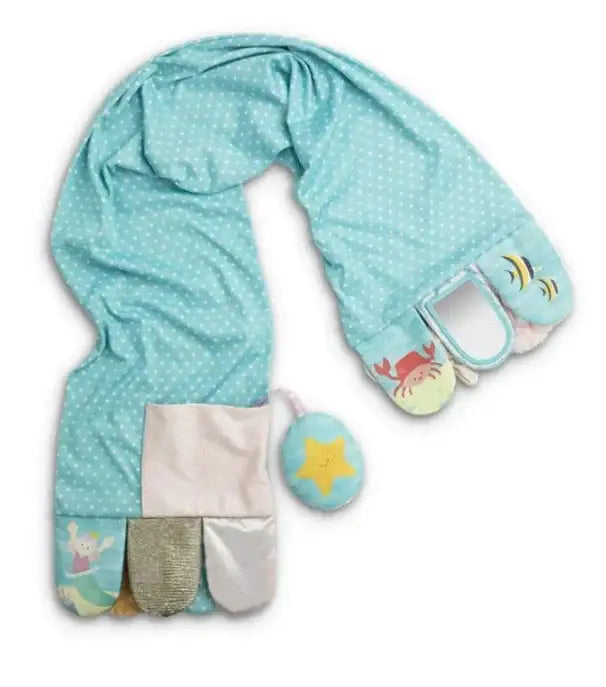 Flat lay of Mermaid activity scarf showing teal polka dot fabric, five textured tabs with plush star on white background