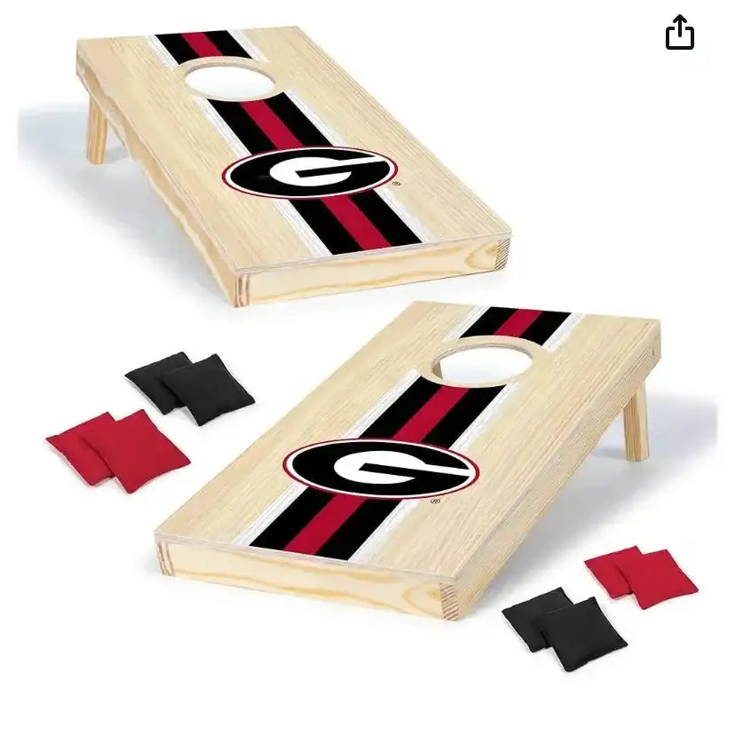 Angled view of 1 ft x 2 ft solid wood Georgia Bulldogs cornhole set showing G logo and red-black stripe on white background