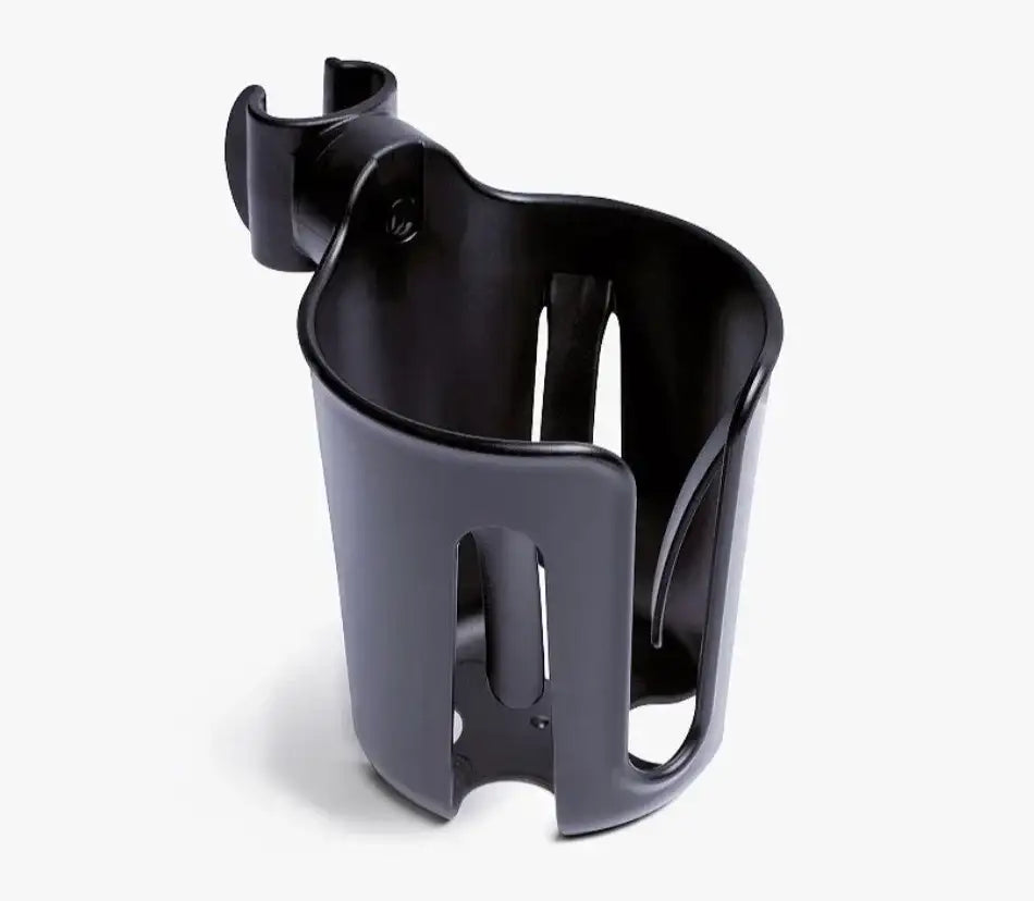 Three-quarter view of Stokke Yoyo stroller cup holder showing open-top compartment and clamp attachment on white background