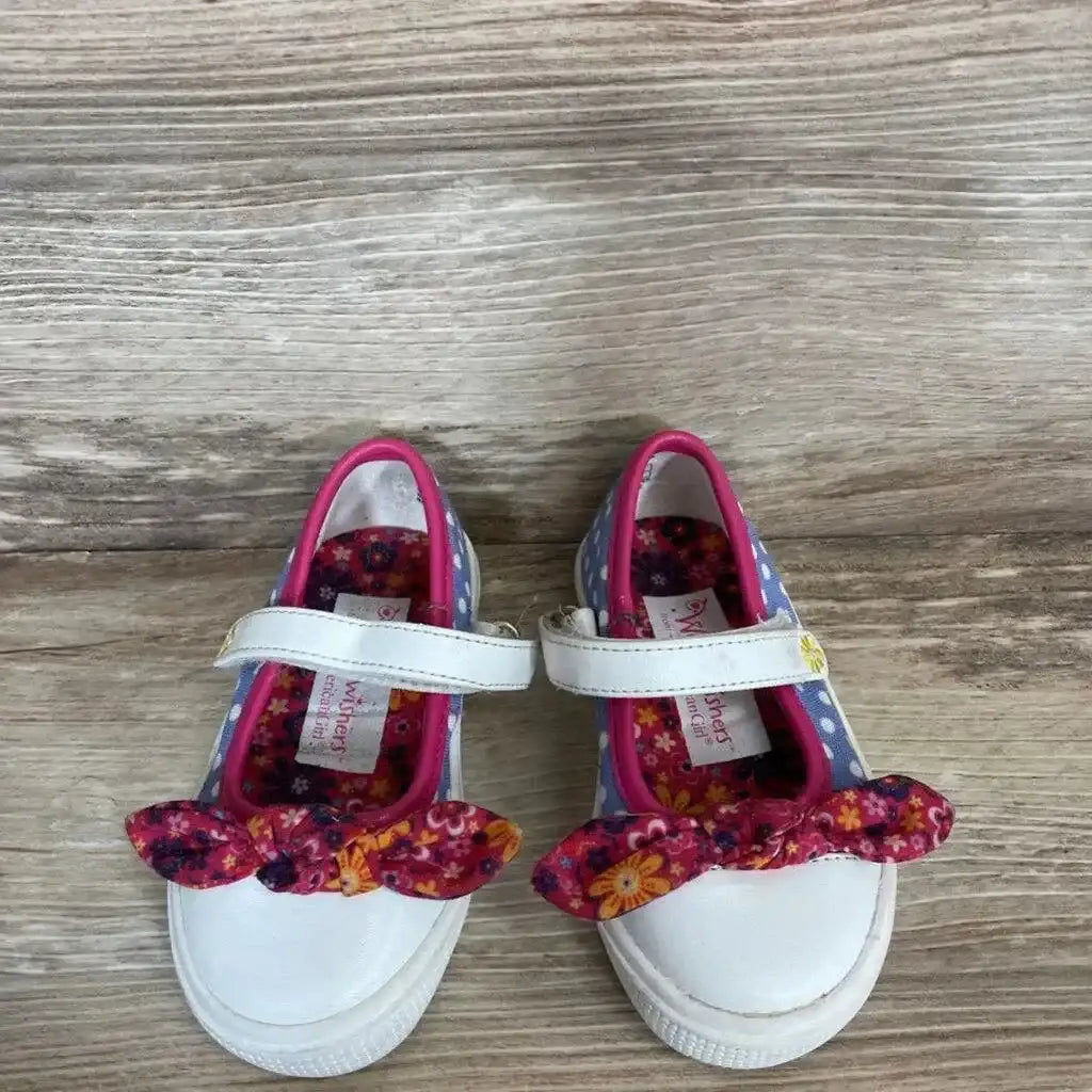 Top view of American Girl Wellie Wishers shoes size 5c with white toes, blue polka-dot sides, pink floral bows and Velcro straps