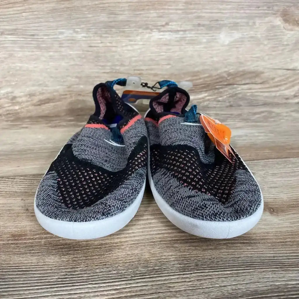 Front view of toddler Speedo slip-on water shoes in grey knit with black and coral accents on a wooden surface, size 4/5Y