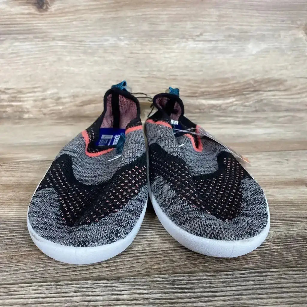Front view of Speedo Junior Surf Strider water shoes, grey knit with black and coral trim, white soles on wood