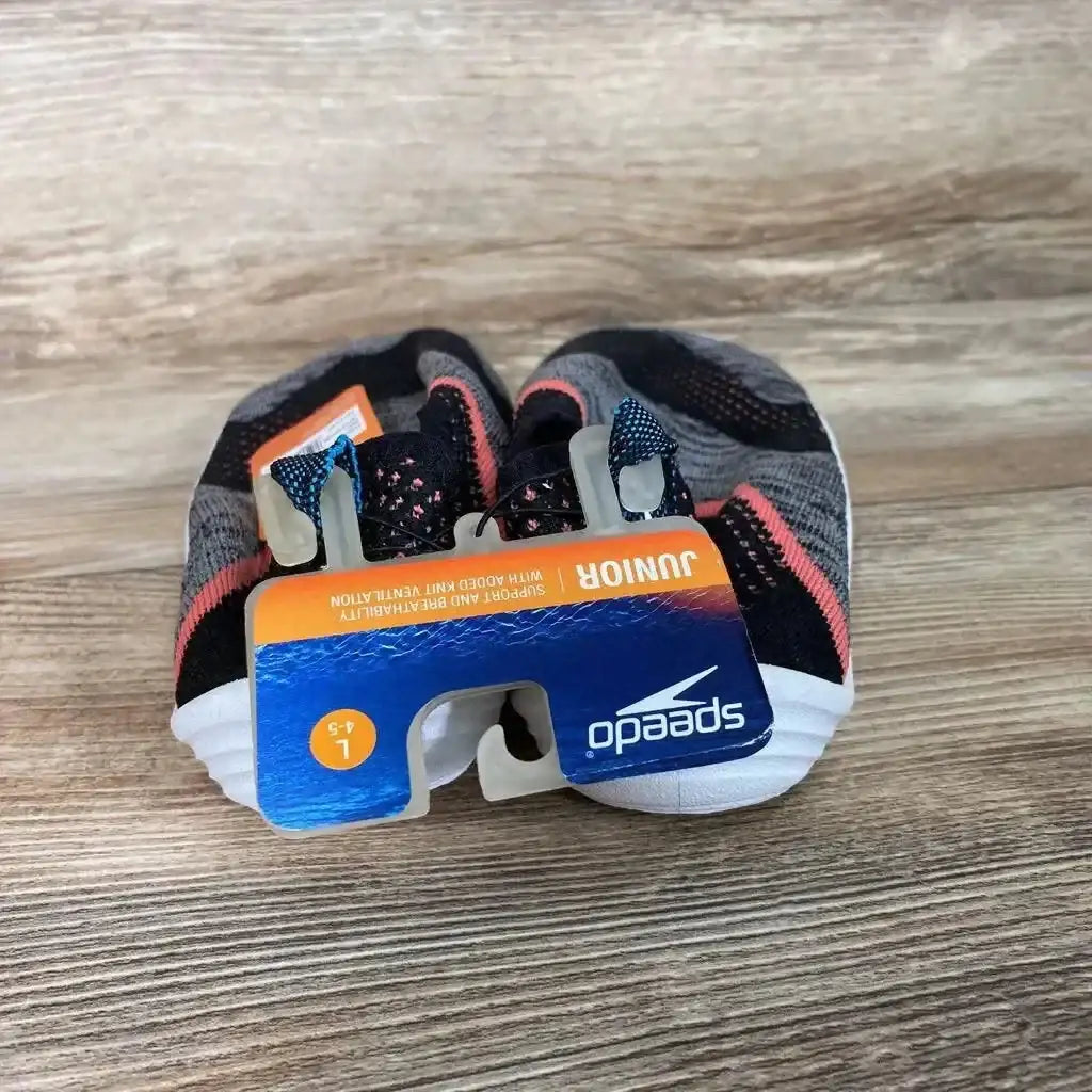 Front view of grey Speedo Junior Surf Strider water shoes (size 4-5Y) showing mesh upper, coral trim, and tag on wood surface