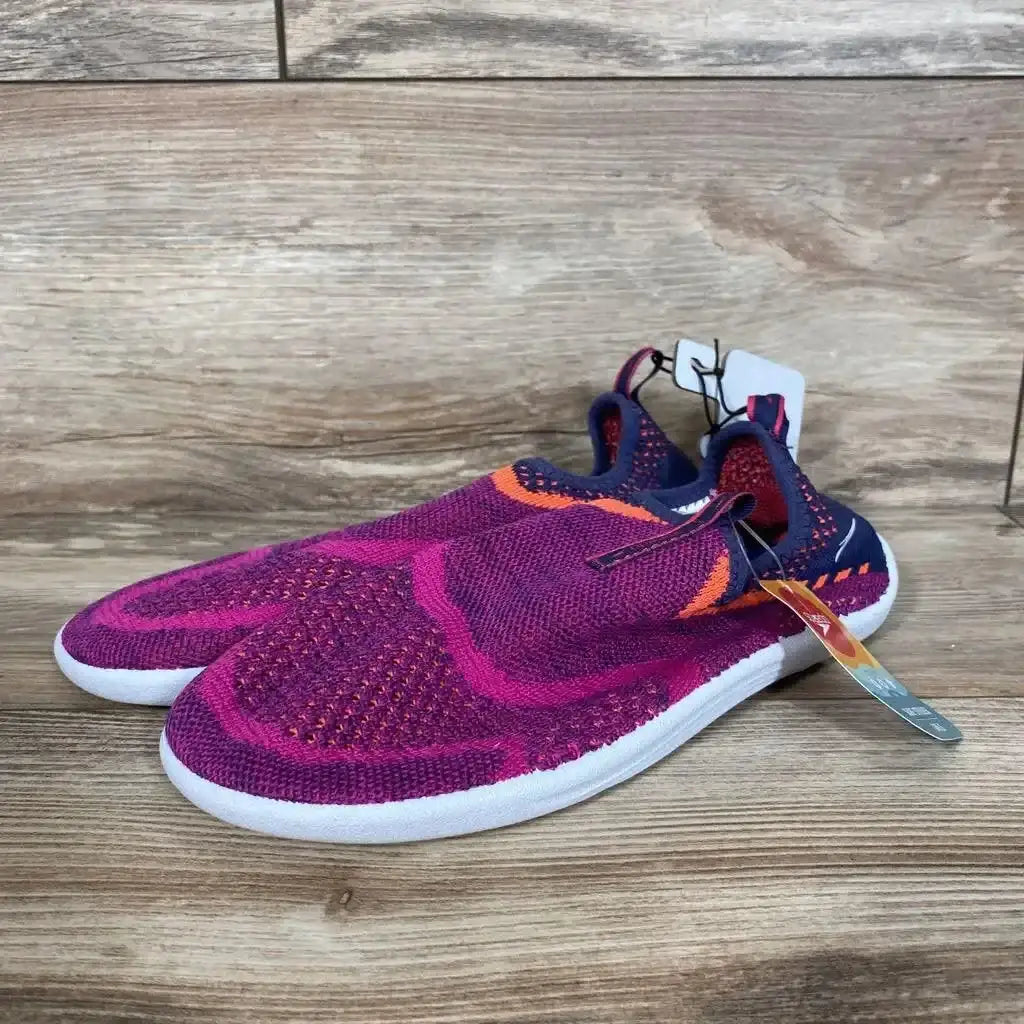 Three-quarter view of NEW Speedo Junior Surf Strider water shoes size 4 to 5Y in magenta knit with hangtag on wood plank floor