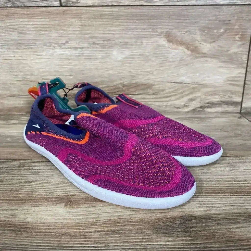 Three-quarter view of Speedo Junior Surf Strider water shoes in fuchsia with elastic heel strap, mesh upper and rubber sole