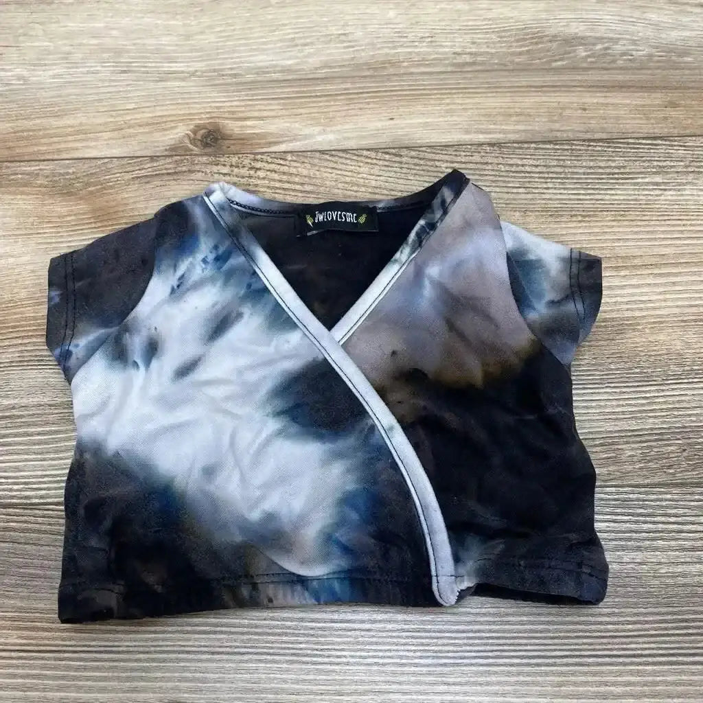 Flat lay of black and gray tie-dye cropped top (size 9-12 months) showcasing wrap-front detail on wood background