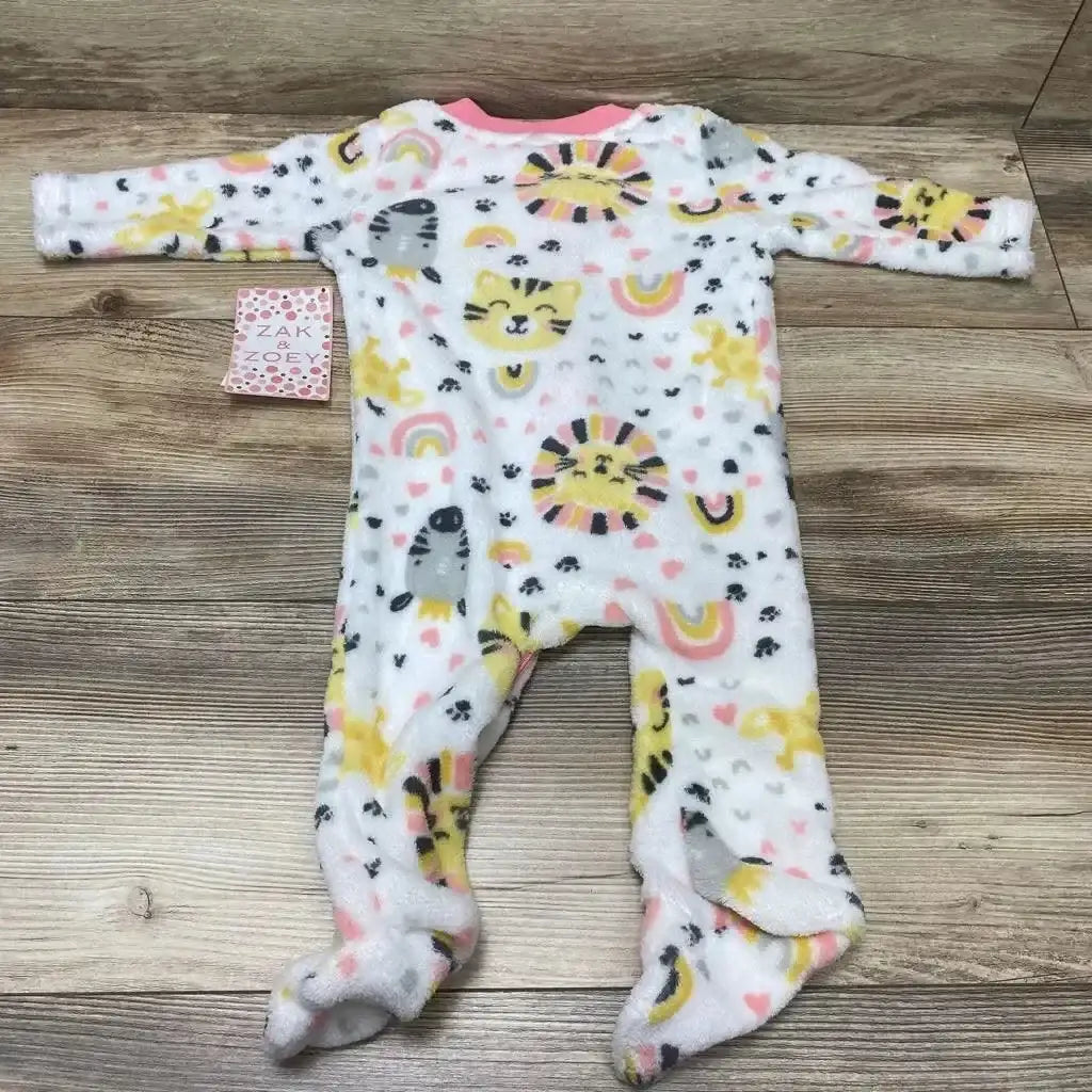 Flat lay of Zak & Zoey footed blanket sleeper size 6-9 months showing yellow and pink animal and rainbow print on wood floor