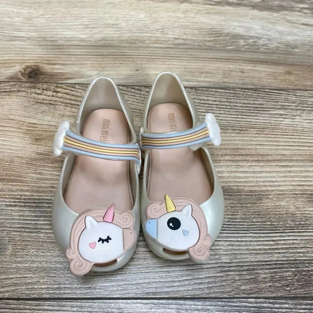 Top view of ivory Mini Melissa Unicorn Mary Jane shoes size 6C with unicorn toe appliques and rainbow elastic strap