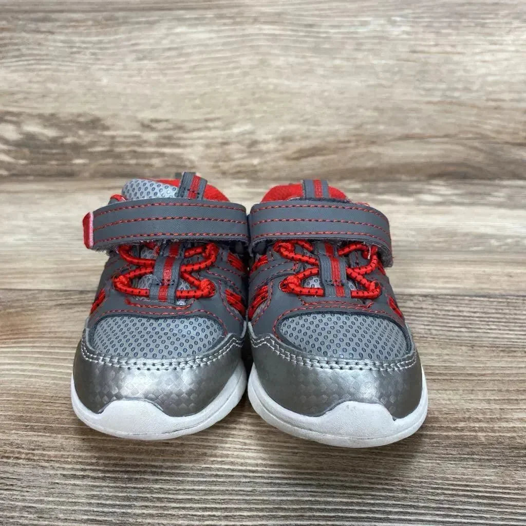 Front view of Athletic Works toddler sneakers size 4C, gray mesh with metallic toe, red accents and Velcro on wood background