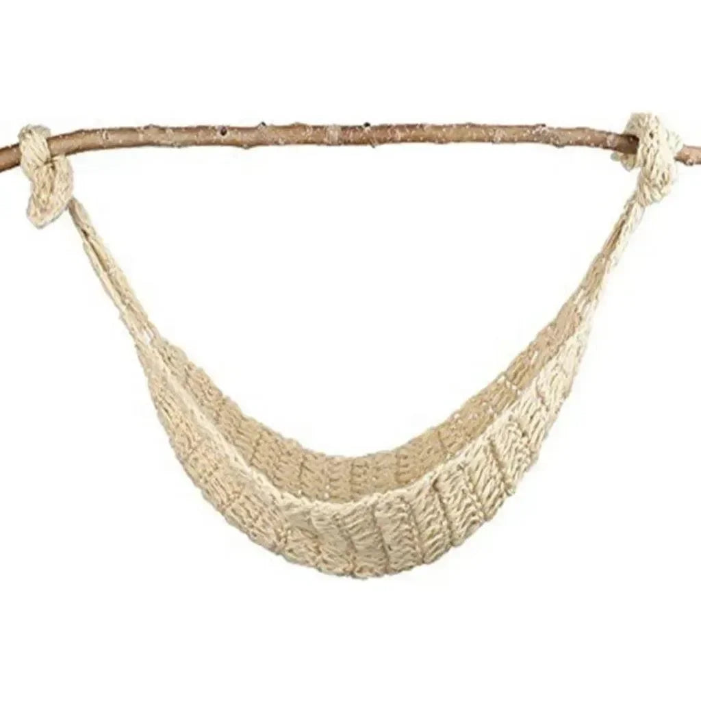 Front view of beige knitted newborn photography hammock showcasing handmade ribbed knit texture and rope loops hung from a natural wood branch on white background