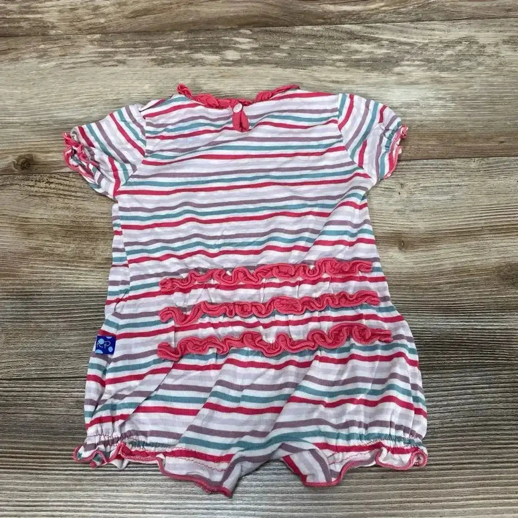 Back view of striped shortie romper (3-6 months) with three pink ruffle tiers and elastic leg openings on wood background