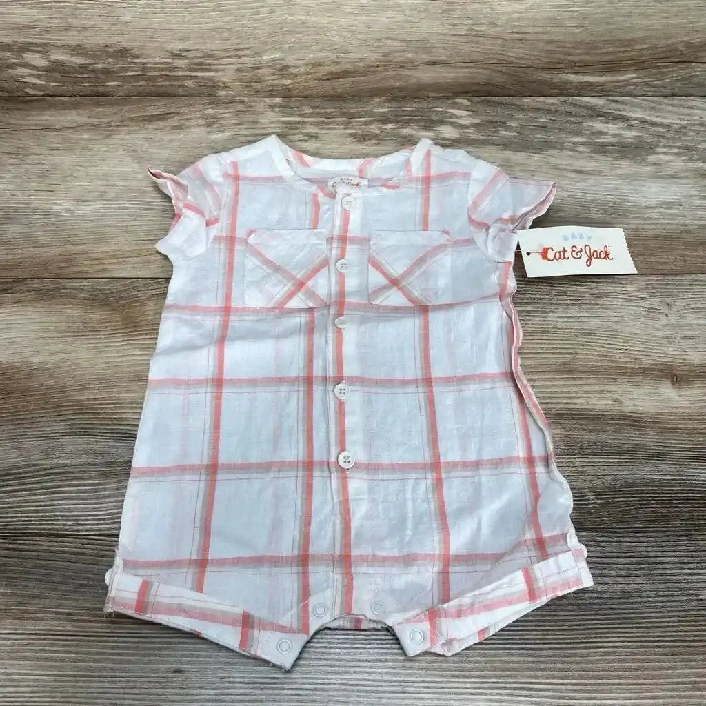 Flat lay of Cat and Jack plaid shortie romper 0-3m with front buttons, snap crotch, flutter sleeves on wood background