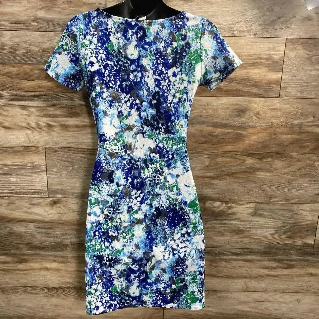 Front view of Pink Blush Maternity Floral Bodycon Dress sz Small showcasing blue green and white watercolor floral print with short sleeves on wood plank background