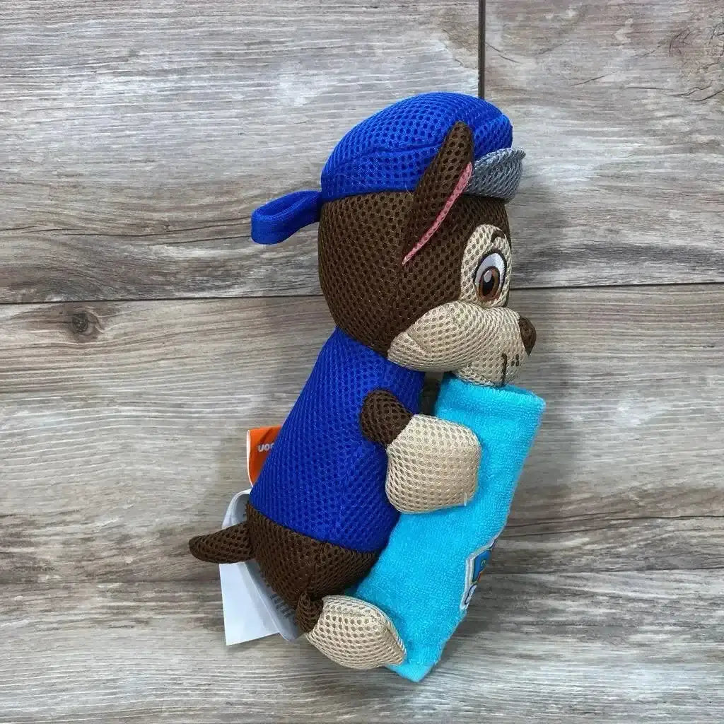 Flat lay of blue Paw Patrol bath towel and matching washcloth showcasing character print and terry texture on white background