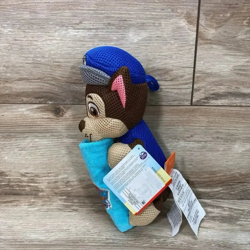 Side view of Paw Patrol Chase-shaped 2-piece bath towel and washcloth set showing blue towel and matching washcloth on wood floor background