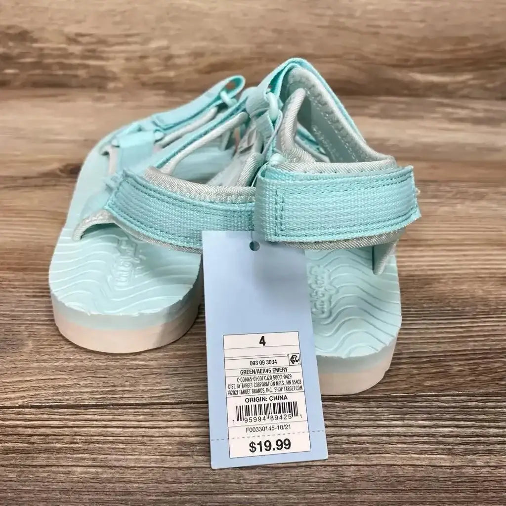 Front view of turquoise toddler ankle-strap sandals, size 4Y, showing Velcro strap and textured footbed on woodgrain