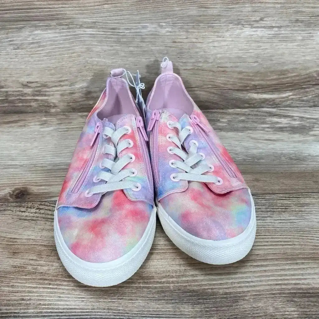 Front view of pink tie-dye Cat & Jack Lucian youth sneakers showing dual side zippers, elastic laces and white rubber soles on wood background