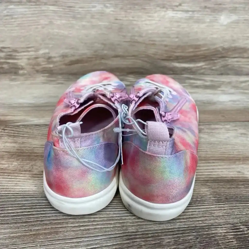 Rear view of Cat and Jack Lucian double zipper pink tie-dye kids sneakers showing heel pull tabs, elastic laces, and white soles on wood background