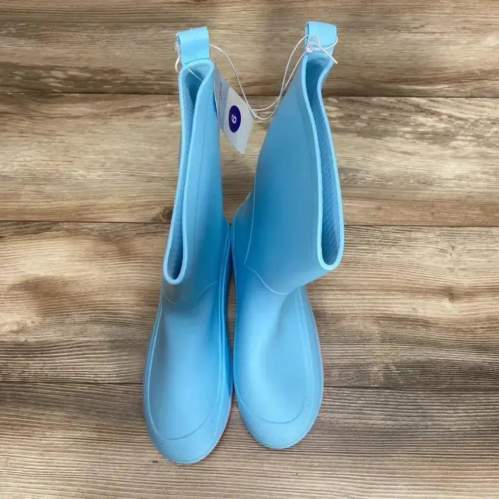Side view of blue Cat & Jack slip-on rain boots, youth 6Y, showing pull tabs and treaded sole