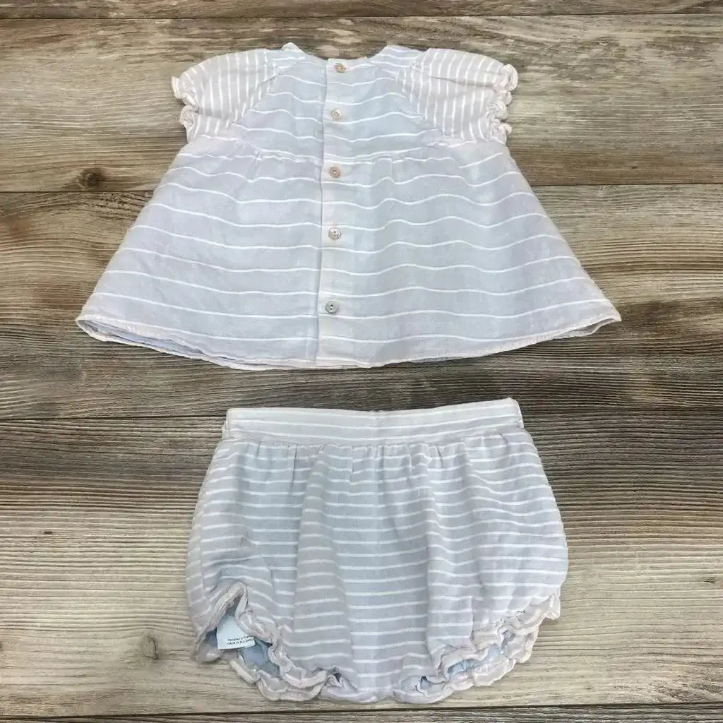 Overhead view of baby blue striped dress and matching bloomers 12m with back buttons, puff sleeves and ruffled legs on wood
