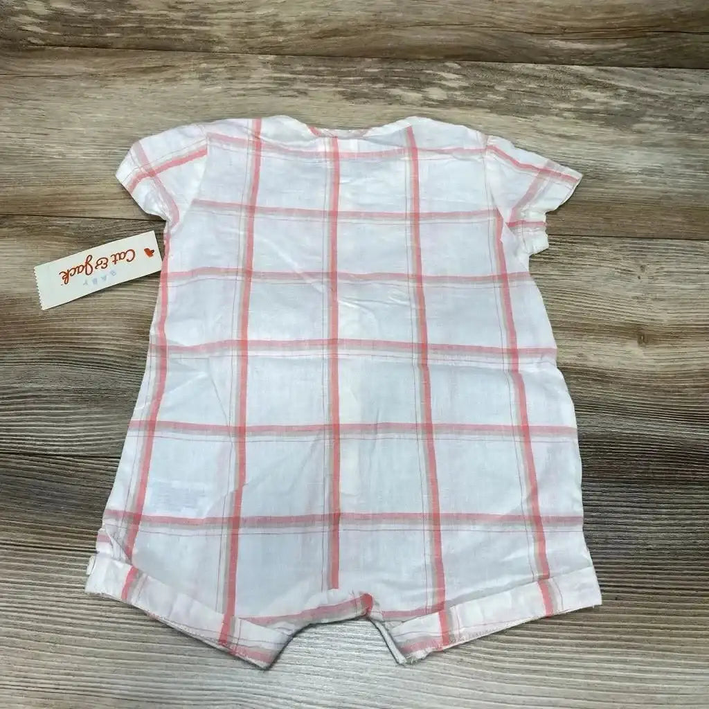 Back view of Cat & Jack shortie romper, white with pink plaid windowpane pattern, size 6–9 months, on wood background