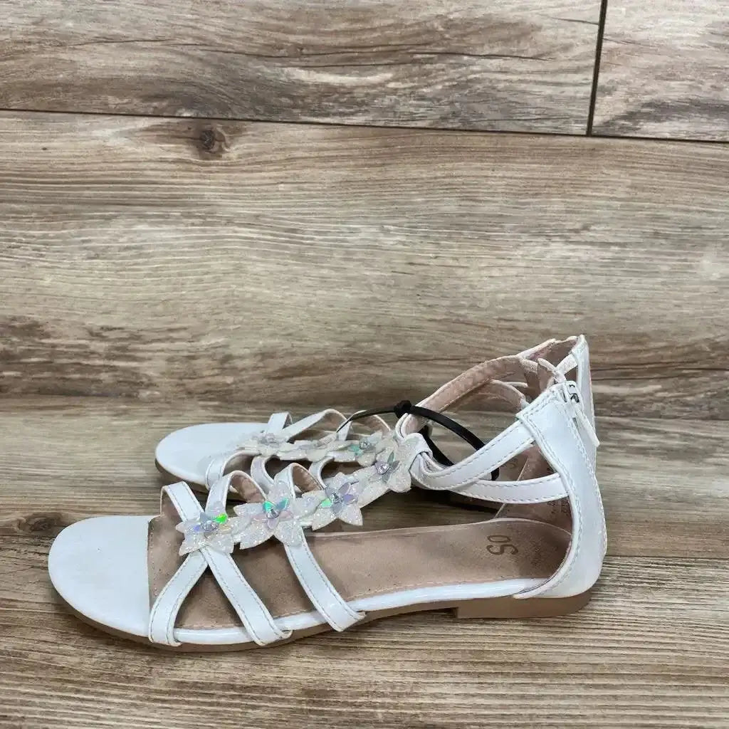 Side view of white New SO Tangelo toddler sandals (3Y) showcasing iridescent flower embellishments on a wood-grain floor