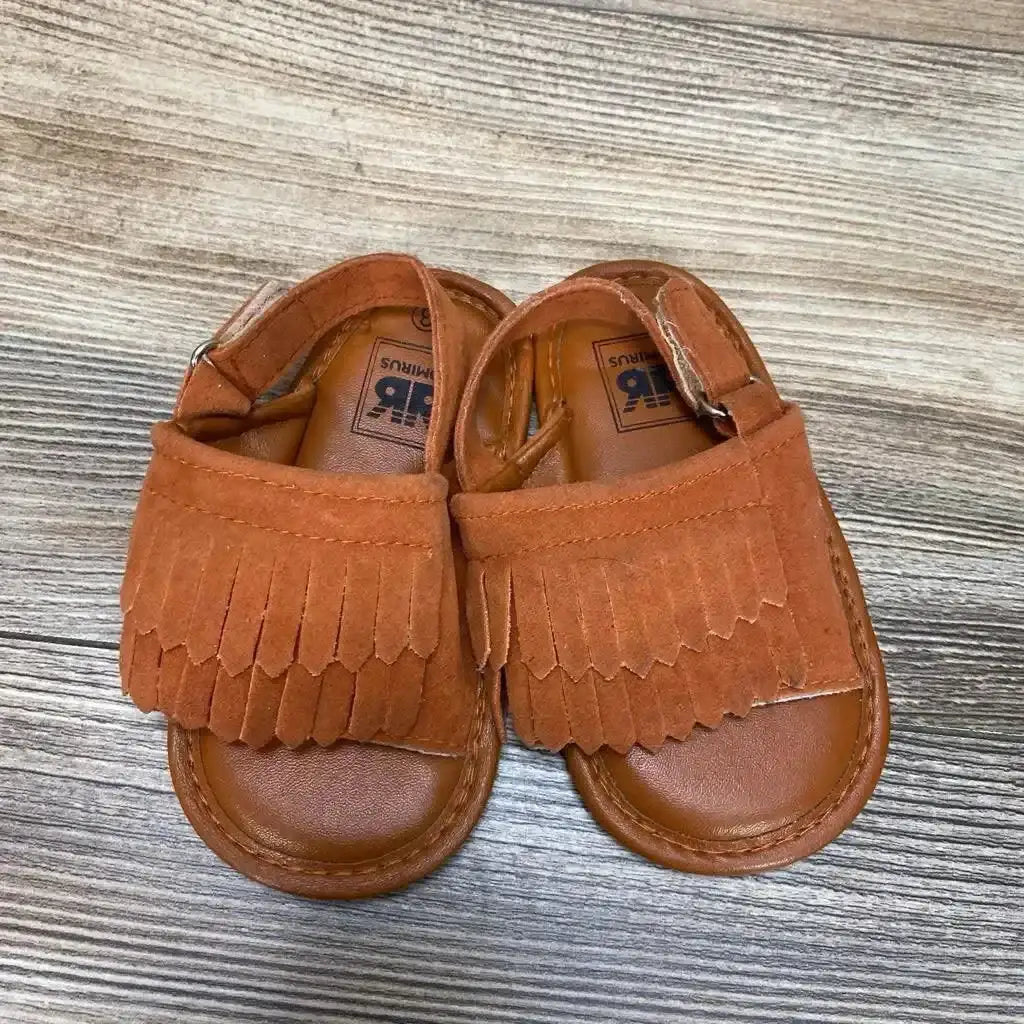 Front view of Romirus red toddler moccasins (size 3C) showing fringe trim and stitched toe on white background
