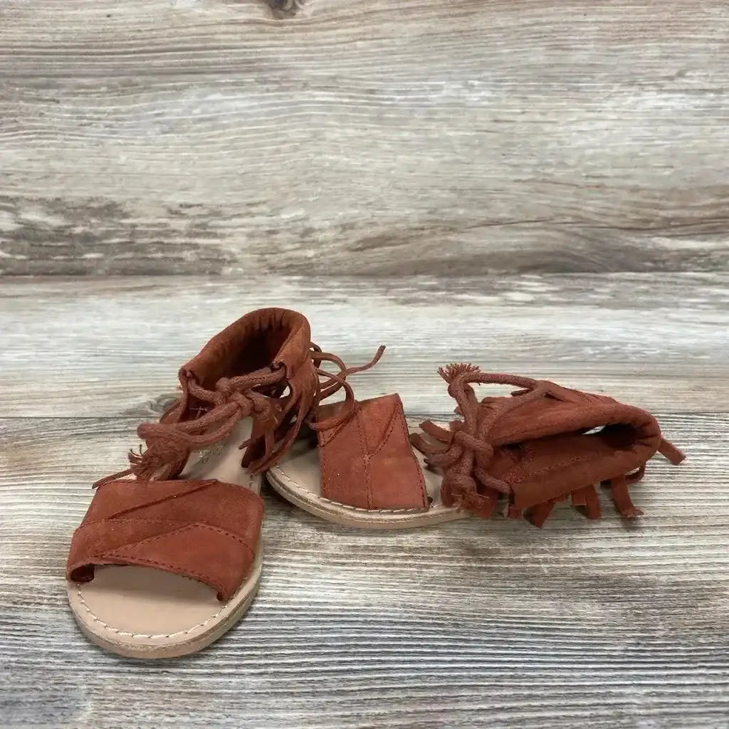 Front and side view of red Zara baby fringe sandals size 4C showcasing fringe detail and ankle strap on white background