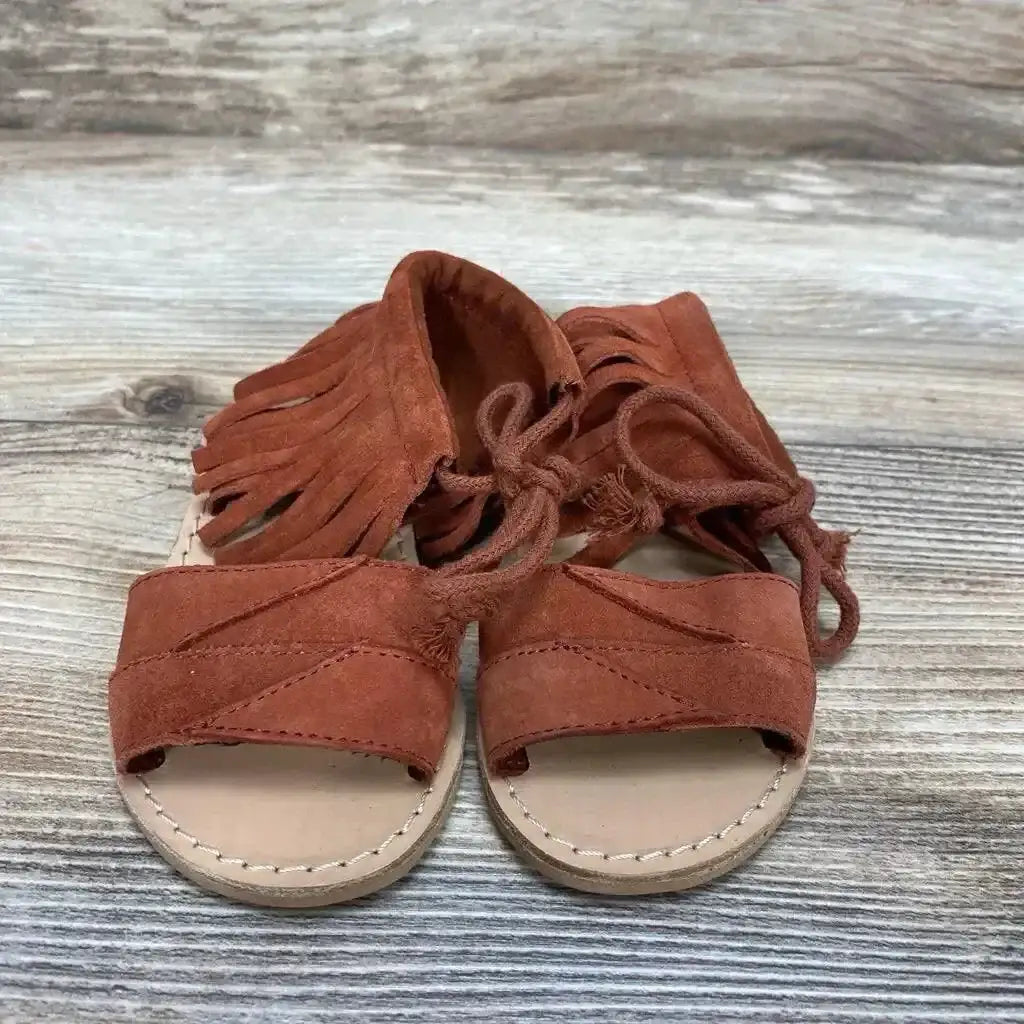 Front and side view of red Zara baby fringe sandals size 4C showcasing fringe detail and ankle strap on white background