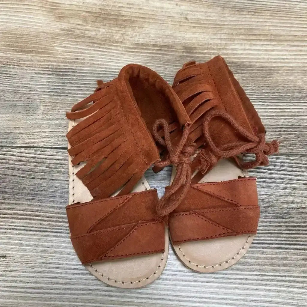Front and side view of red Zara baby fringe sandals size 4C showcasing fringe detail and ankle strap on white background