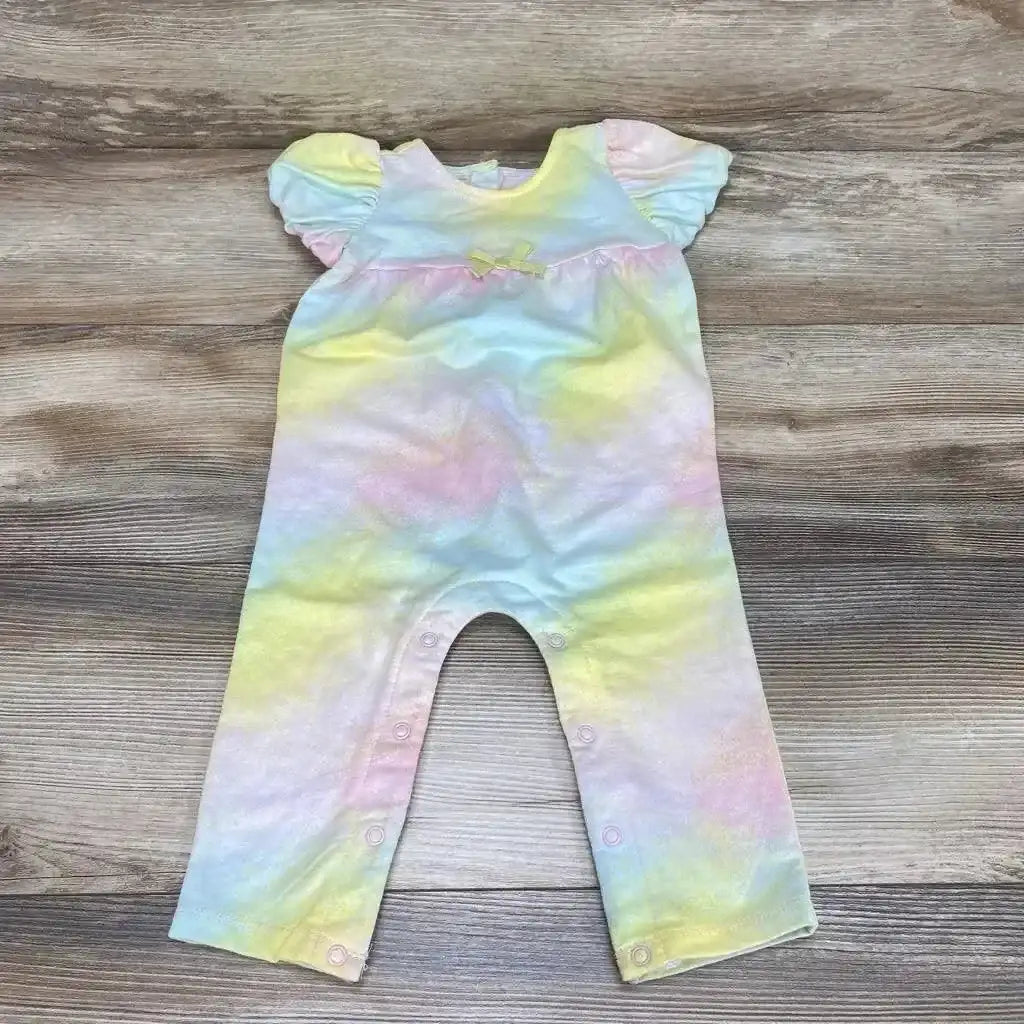 Flat-lay of First Impressions tie-dye romper size 12M showing puff sleeves, front bow and snap leg closures on wood