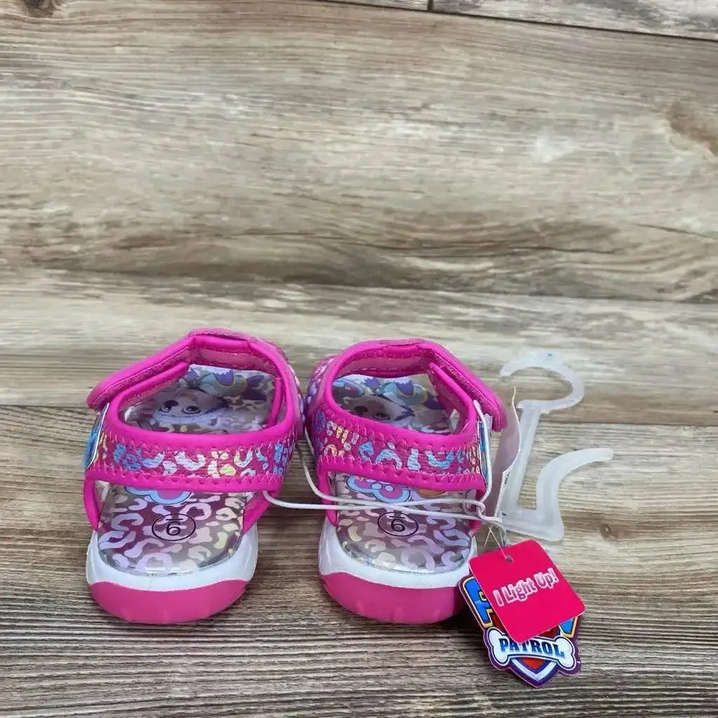 Front view of pink Paw Patrol ankle-strap toddler sandals size 9C with adjustable strap on white background