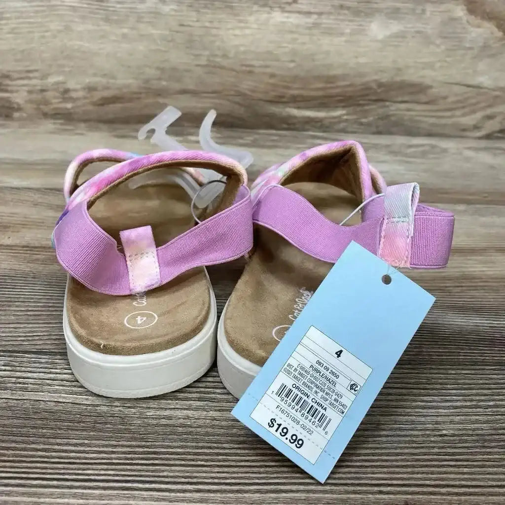 Rear view of Cat & Jack Hazel purple slip-on kids sandals showing elastic ankle straps and white platform soles on wood background